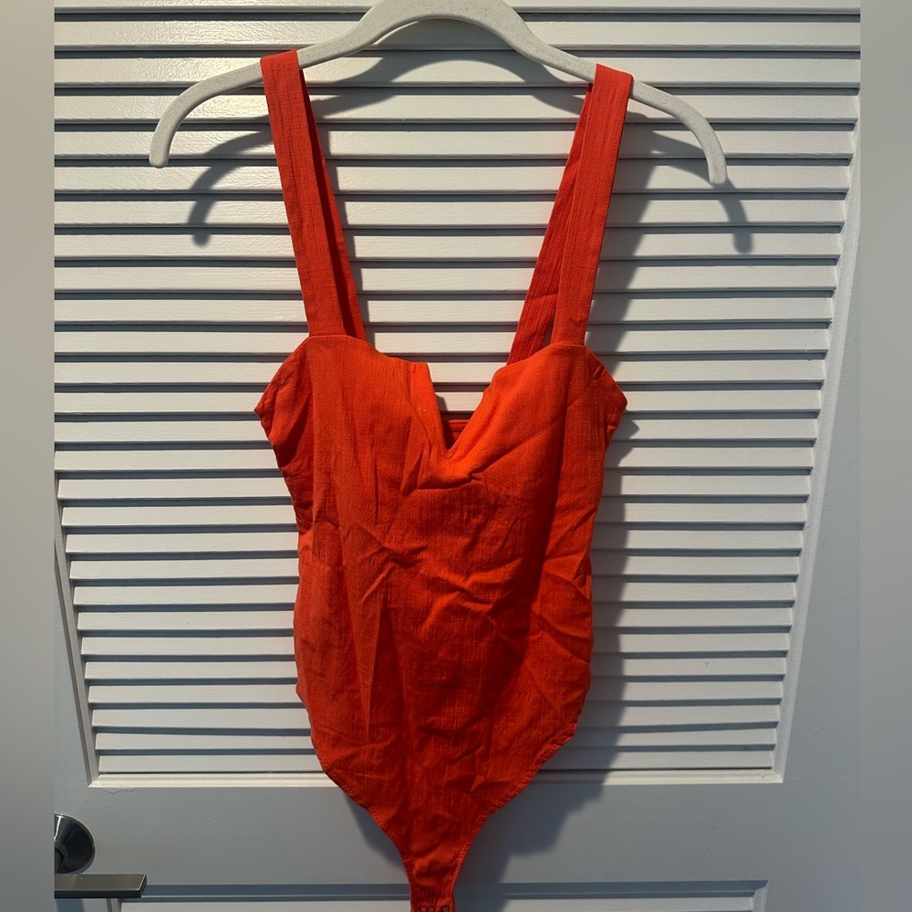 Free people, orange body suit